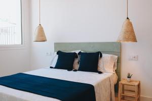 Ένα ή περισσότερα κρεβάτια σε δωμάτιο στο Apartamento B