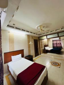 Postel nebo postele na pokoji v ubytování HOTEL GOLDeN PARK