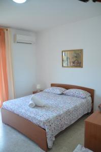 a bedroom with a bed in a room at Taormina Bay Lucia's House 3 in Nizza di Sicilia