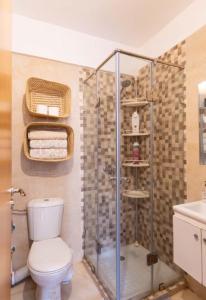 a bathroom with a toilet and a shower at Marrakech Bloom Residence II in Oulad Akkou