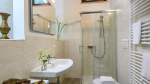 a bathroom with a sink and a shower at Acquanera 6&2 by Marche Holiday Villas in Piobbico +54 photos