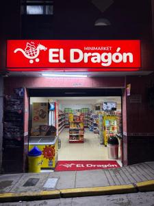 a store with an el dragon sign on the front at Hotel Cordillera Blanca in Caraz