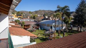 an overhead view of a resort with tables and umbrellas at Bungalows Punta Azul in Villa Carlos Paz