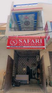 a building with a sign for a secret guest house at Safari Guest House in Hyderabad