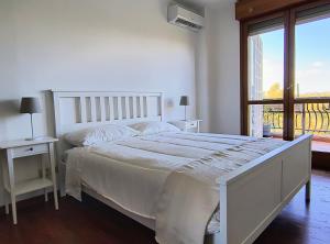 Voodi või voodid majutusasutuse BePlace La Nuvola toas +17 fotot