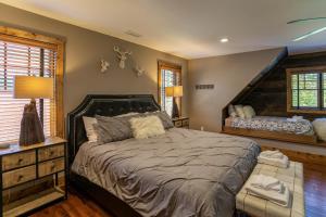 a bedroom with a large bed in a room at Snowflake River Ridge at Eagles Nest in Banner Elk +27 photos