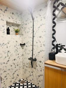 a bathroom with a shower and a sink at Row House Near US Consulate BKC & NMCC in Mumbai