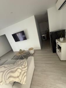 a living room with a couch and a table at Évasion détente in Étouars