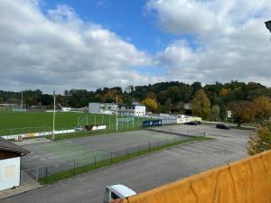 a parking lot with a tennis court on it at WG Riedau in Riedau