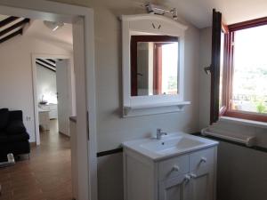 a bathroom with a sink and a mirror at Villa Agava in Vrboska
