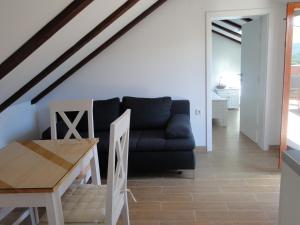 a living room with a couch and a table at Villa Agava in Vrboska