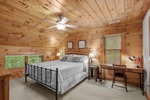 a bedroom with a bed and a wooden ceiling at Among The Trees in Vilas