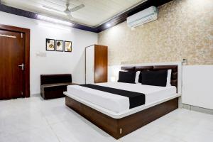 Krevet ili kreveti u jedinici u okviru objekta Hotel O Saraswati Resort