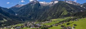 a village in a valley with mountains in the background at Appartment Krimmler Bergtraum in Krimml