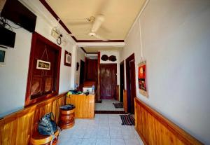 a hallway of a house with a room with a hallway at The Luang Prabanag Hostel in Luang Prabang