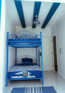 Postel nebo postele na pokoji v ubytování Dar Ajmia Villa