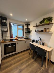 a kitchen with a table and a counter top at L'Appartamentino in Cork
