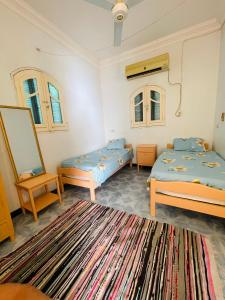 Postel nebo postele na pokoji v ubytování ايـو كـاتو + 17 fotografií