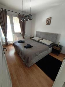 a bedroom with a large bed in a room at APARTMÁN - 3 izbový byt in Veľký Krtíš