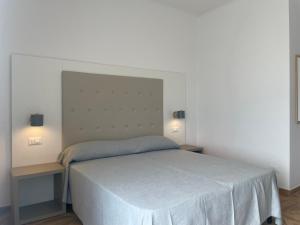 Postel nebo postele na pokoji v ubytování Dormi e Vai + 4 fotografie