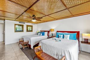 a bedroom with two beds and a ceiling at Maui Eldorado Condo A104 in Kaanapali +55 photos