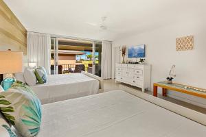 a large bedroom with a bed and a dresser at Maui Eldorado Condo J206 in Kaanapali +61 photos