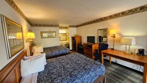 Ένα ή περισσότερα κρεβάτια σε δωμάτιο στο Imperial Lodge