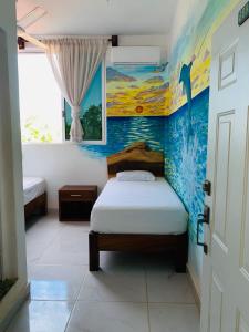 Ένα ή περισσότερα κρεβάτια σε δωμάτιο στο Hotel Bambu