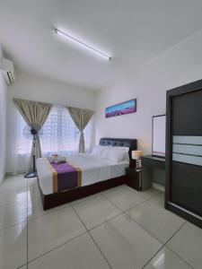 Una cama o camas en una habitación de Savanna Residence Southville City