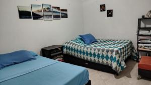 a bedroom with two beds in a room at DESTINY Apto Central in San Rafael