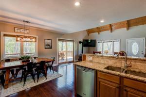 a kitchen and dining room with a table and a dining room at Sugar Rush in Sugar Mountain