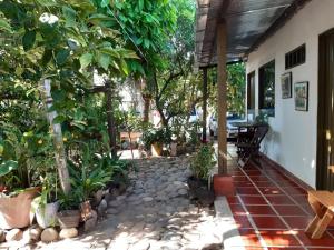 a patio with a bunch of trees and plants at Hotel Tatacoa Experience in Villavieja