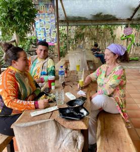 a group of people sitting at a table at Hotel Tatacoa Experience in Villavieja