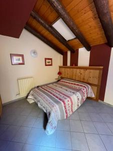 Postel nebo postele na pokoji v ubytování La mansarda di Cerise + 3 fotografie