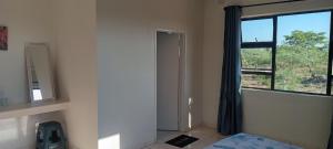 Voodi või voodid majutusasutuse WaterBerry Guesthouse Masvingo toas