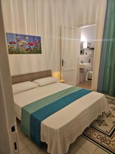 Postel nebo postele na pokoji v ubytování Palazzo Gentile