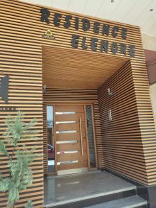 a building with the entrance to a reference library at Appartement Ennour de Martil in Martil +1 photo