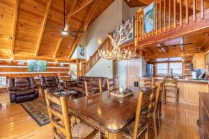 a dining room and kitchen with a wooden table and chairs at Ambleside in Vilas