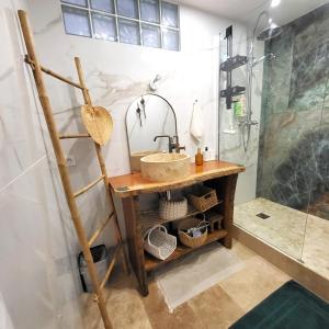 a bathroom with a sink and a shower at GILMORE Home - close to PARIS center in La Courneuve +34 photos