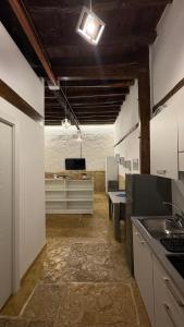 a kitchen with a sink and a counter top at La perla casa vacanze in Barletta