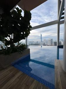 a swimming pool with a view of the city at The Infinitum Eternity Luxe By Crystal KLCC in Kuala Lumpur