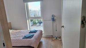 Postel nebo postele na pokoji v ubytování Apartament Kameralny