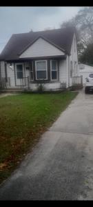 a house with a car parked in front of it at GA home in Milwaukee