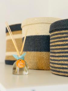 a close up of a table with a basket and a candleholder at L'Ecume - Le Rheu in Le Rheu