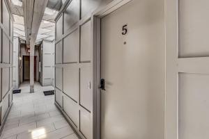a hallway with a door with the on it at Parker's Collection Unit 5 in Savannah