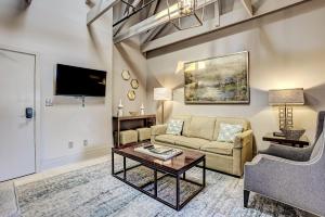 a living room with a couch and a table at Parker's Collection Unit 8 in Savannah