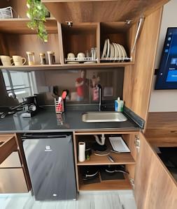 a kitchen with a sink and a counter at Epic Suite 210 Deluxe Aeropuerto in Cuba