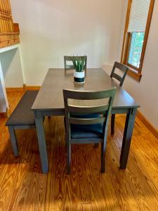 a table with two chairs and a potted plant on it at Free Parking - Prime Location - Downtown in Columbus