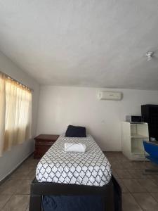 Ένα ή περισσότερα κρεβάτια σε δωμάτιο στο Casa blanca apartment