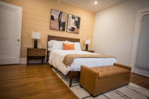 a bedroom with a bed and a chair and two pictures at Location! Downtown San Antonio, Southtown, King William in San Antonio +19 photos